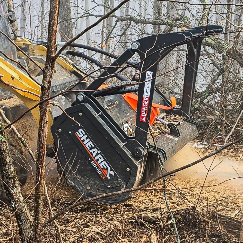 Down South Land Solutions Shearex mulcher grinding stumps and clearing brush in the woods